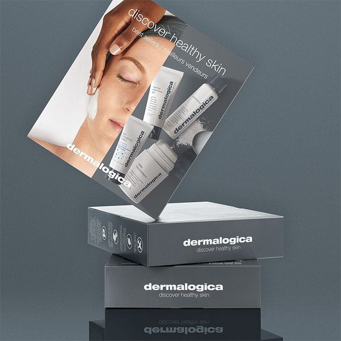 Hautpflegeproduktboxen mit dem Schriftzug "discover healthy skin" und Bildern von Hautpflegeprodukten sowie einer Frau, die eine Gesichtscreme anwendet.