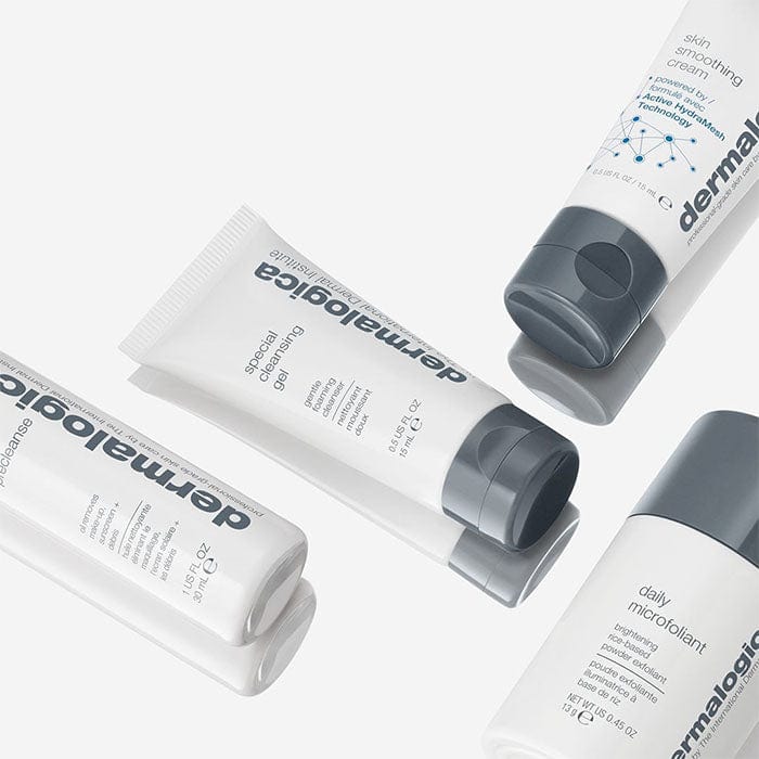 Vier Tuben Dermalogica Hautpflegeprodukte auf hellem Hintergrund.