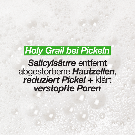 Nahaufnahme von Schaum mit Text, der die Vorteile von Salicylsäure bei der Pickelbehandlung beschreibt.