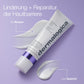 Stabilizing Repair Serum-Tube auf violetter Fläche mit weißen Cremespuren; der deutsche Text hebt die Stärkung der Hautbarriere für Körper und Gesicht hervor.