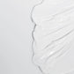 Eine Nahaufnahme einer weißen Creme auf weißem Hintergrund mit Protection 50 Sport SPF 50 156 ml | Sonnenschutzcreme.